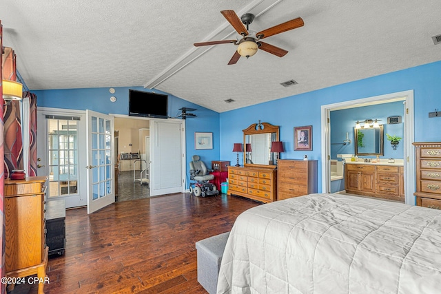 bedroom with ensuite bath, ceiling fan, a textured ceiling, dark wood-type flooring, and lofted ceiling with beams