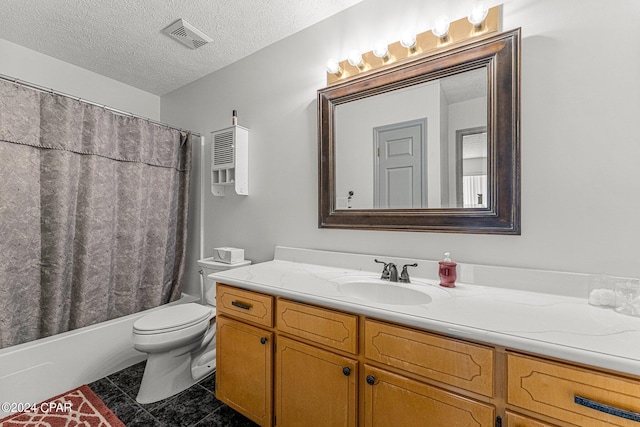 full bathroom featuring vanity, shower / bath combo with shower curtain, tile floors, a textured ceiling, and toilet