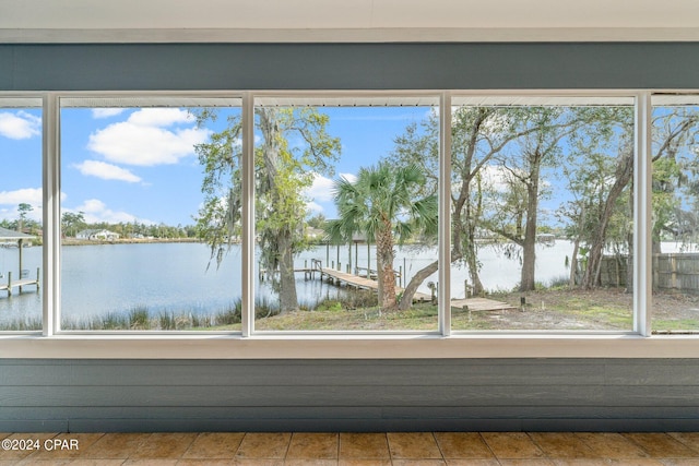 interior space featuring plenty of natural light and a water view