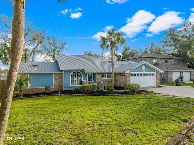 single story home with a front yard and a garage