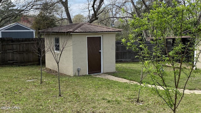 view of outdoor structure with a lawn