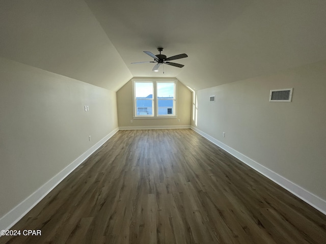 additional living space with dark hardwood / wood-style flooring, ceiling fan, and lofted ceiling