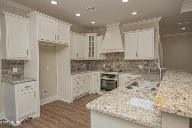 unfurnished room featuring crown molding, ceiling fan, and dark wood-type flooring