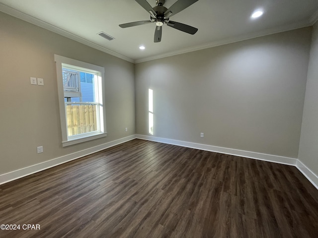 spare room featuring dark hardwood / wood-style floors, ceiling fan, and ornamental molding