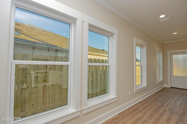 unfurnished bedroom featuring a closet, dark hardwood / wood-style floors, ceiling fan, and crown molding