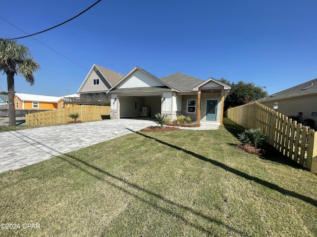 view of front of property featuring a carport and a front lawn