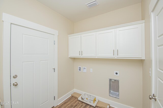 kitchen with ornamental molding, white cabinetry, sink, and black electric cooktop