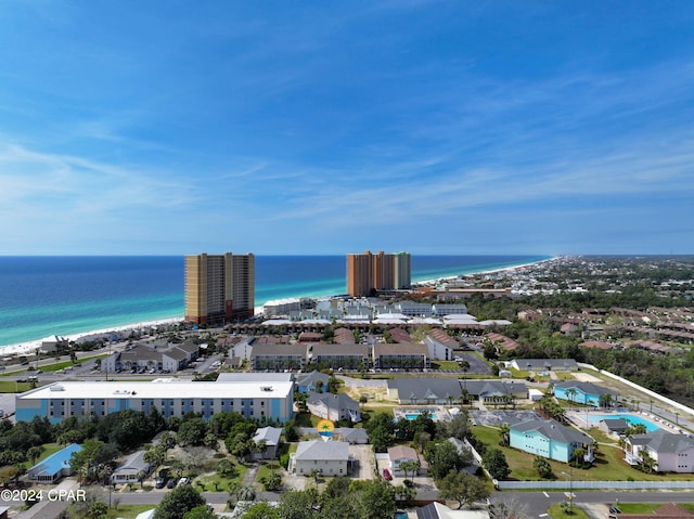 drone / aerial view featuring a beach view and a water view