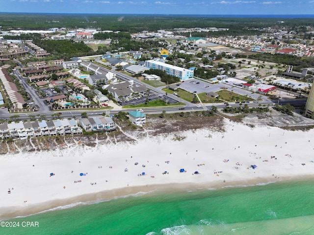 birds eye view of property with a beach view and a water view