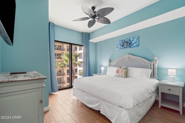 bedroom featuring access to outside, ceiling fan, and light wood-type flooring