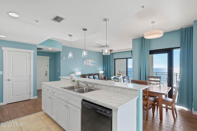 kitchen with white cabinets, hanging light fixtures, dishwasher, and sink