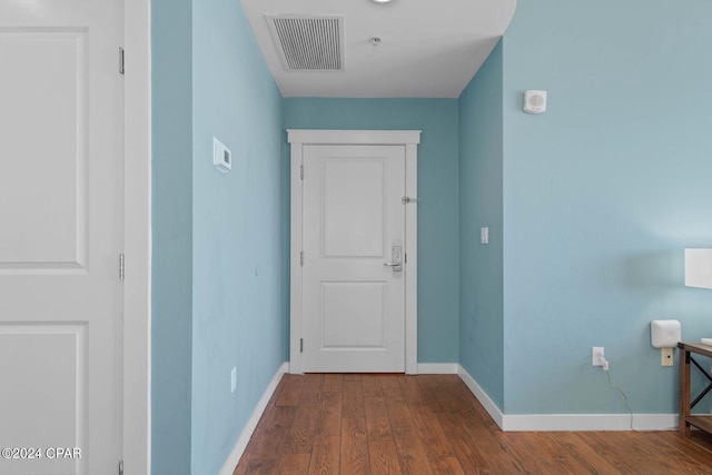 hall with dark hardwood / wood-style flooring