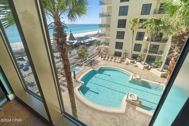 view of pool featuring a water view