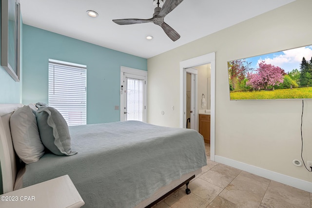 bedroom with ceiling fan and ensuite bath