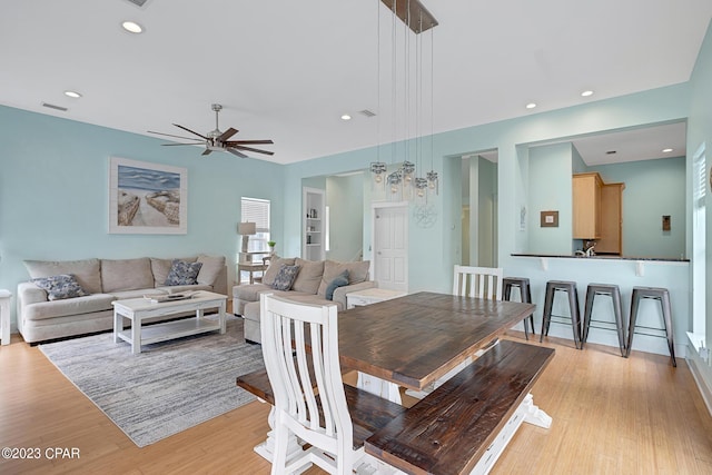 dining room featuring ceiling fan and light wood-type flooring