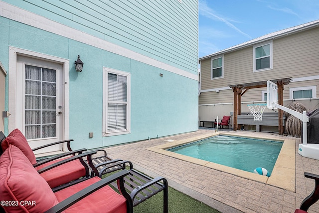 view of swimming pool with a pergola and a patio