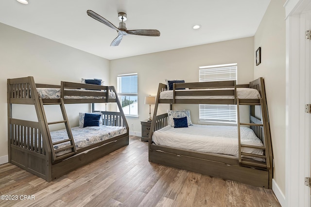 bedroom featuring hardwood / wood-style floors and ceiling fan