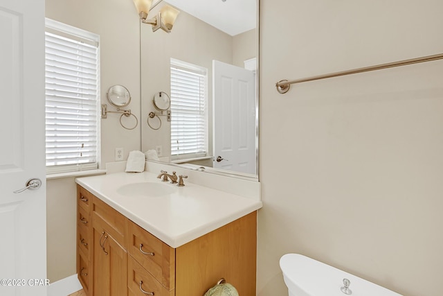 bathroom with vanity and toilet