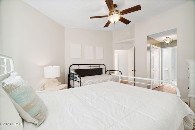 bedroom with ceiling fan and ensuite bath