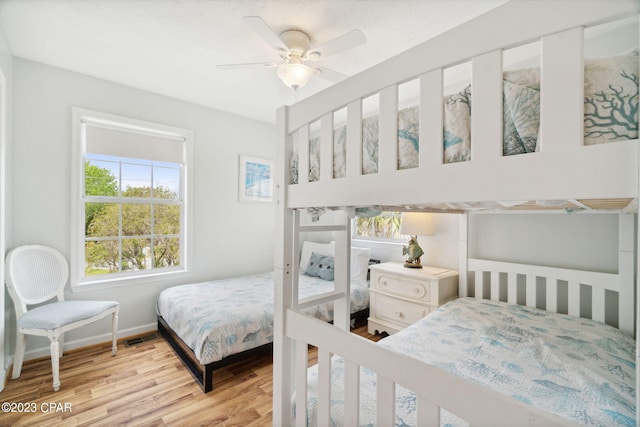 bedroom featuring light hardwood / wood-style floors and ceiling fan