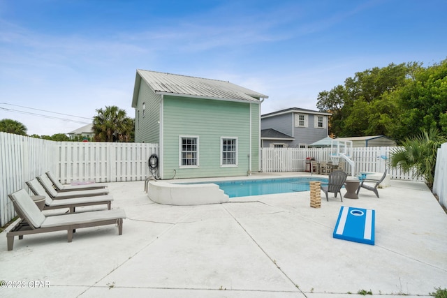 view of swimming pool featuring a patio