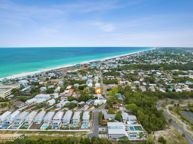 bird's eye view with a water view and a view of the beach