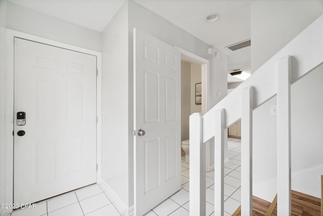 bathroom featuring tile patterned floors and toilet