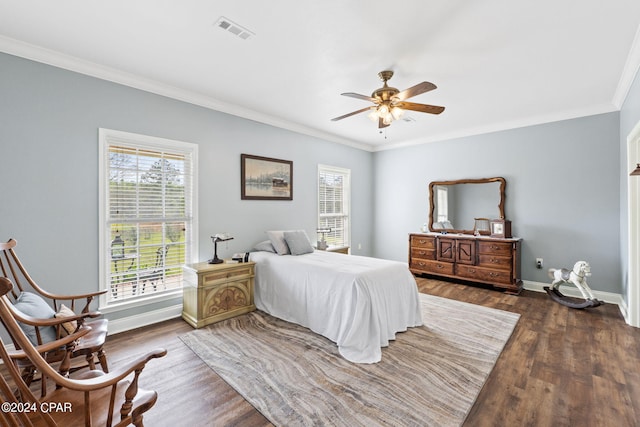 bedroom featuring ornamental molding, ceiling fan, and dark hardwood / wood-style floors