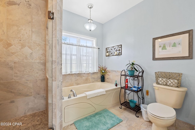 bathroom with a bath, tile floors, and toilet