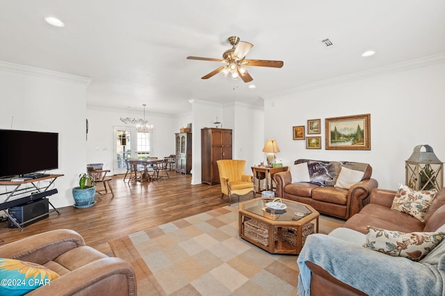 living room with crown molding, ceiling fan with notable chandelier, and light wood-type flooring