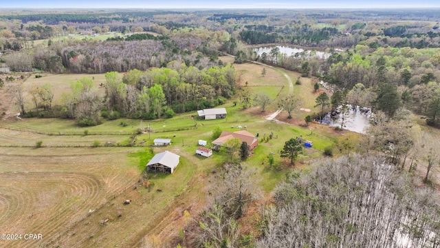 birds eye view of property featuring a rural view and a water view