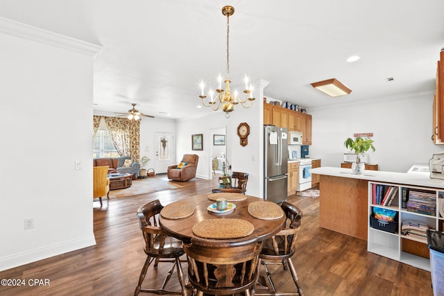 dining room featuring ceiling fan with notable chandelier, dark hardwood / wood-style flooring, and ornamental molding