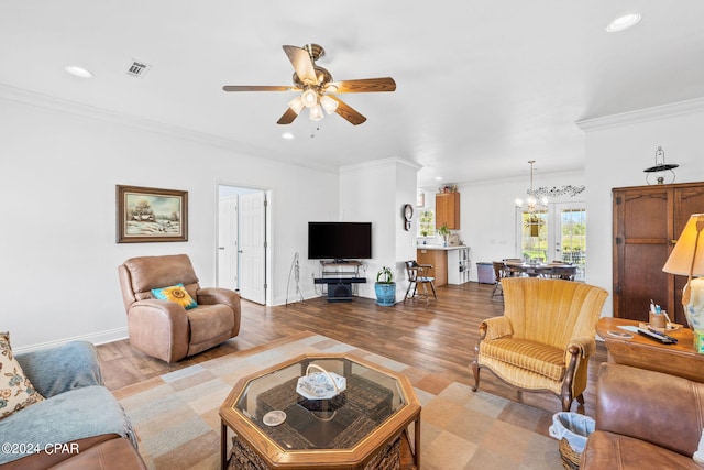 living room featuring crown molding, light hardwood / wood-style floors, and ceiling fan with notable chandelier