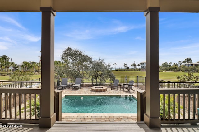 view of pool featuring a patio area and an outdoor fire pit