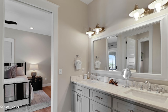 bathroom featuring double sink vanity and hardwood / wood-style flooring