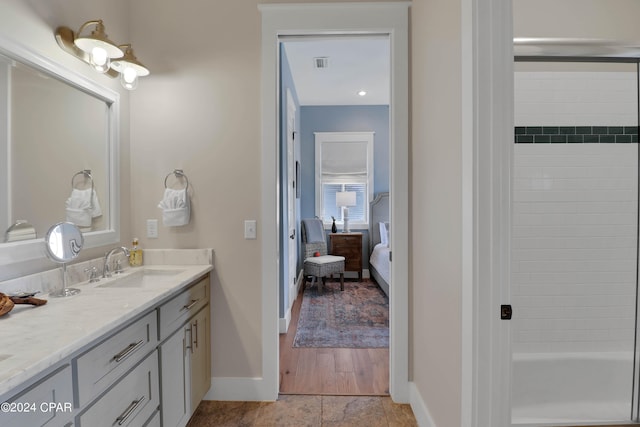 bathroom featuring vanity and hardwood / wood-style floors