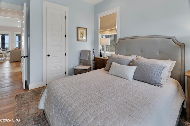 bedroom with wood-type flooring