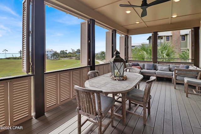 sunroom featuring plenty of natural light and ceiling fan