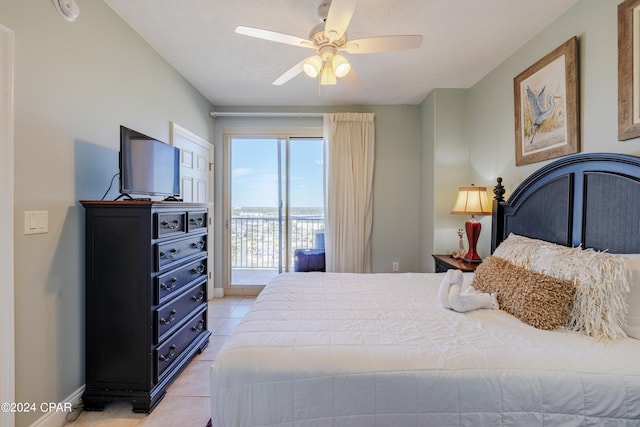 bedroom with light tile floors, access to outside, and ceiling fan