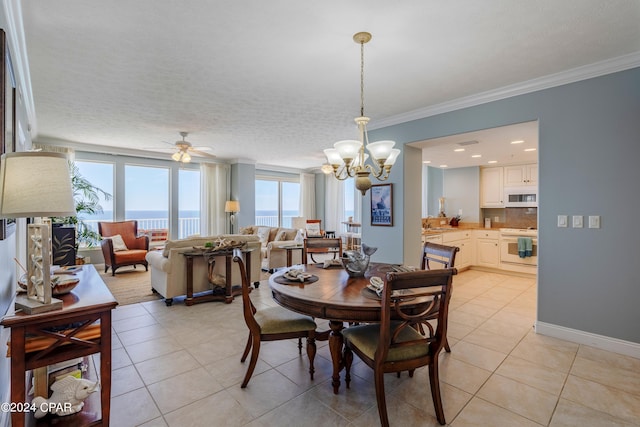 dining room featuring a textured ceiling, crown molding, ceiling fan with notable chandelier, and light tile flooring