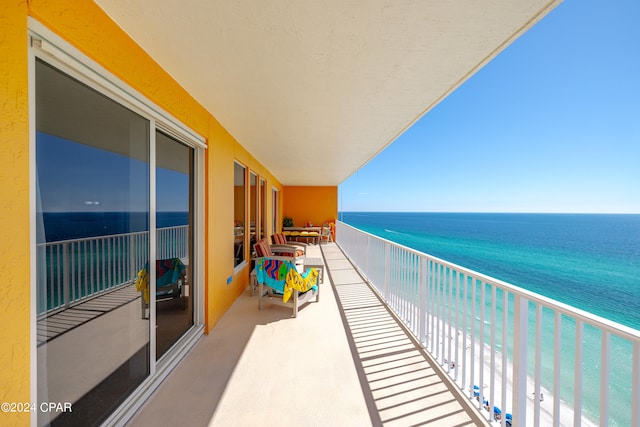 balcony featuring a water view