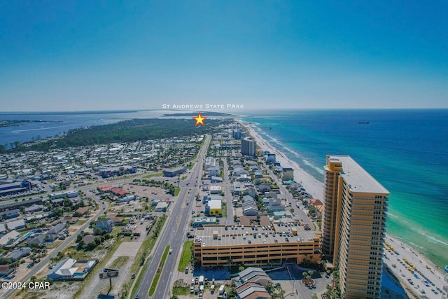 aerial view with a water view and a view of the beach