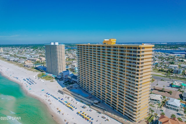 birds eye view of property with a view of the beach and a water view