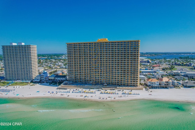 birds eye view of property featuring a water view and a view of the beach