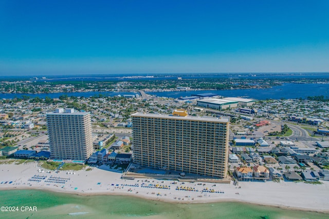 drone / aerial view with a water view and a view of the beach