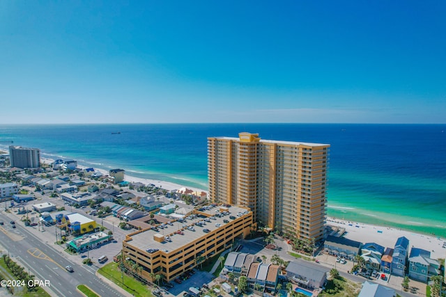 bird's eye view featuring a water view and a view of the beach