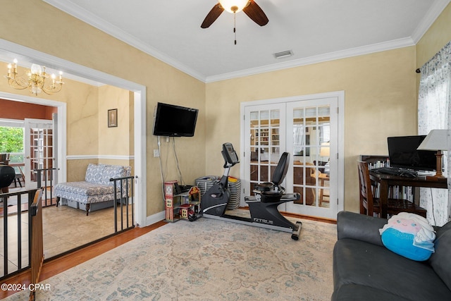 workout area featuring crown molding, visible vents, wood finished floors, and french doors