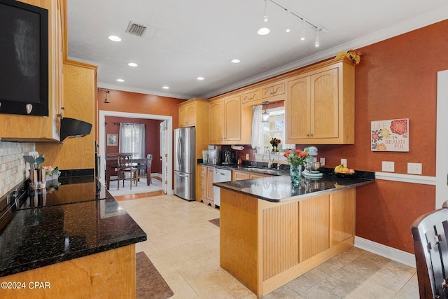 kitchen with visible vents, dishwasher, freestanding refrigerator, a peninsula, and a sink