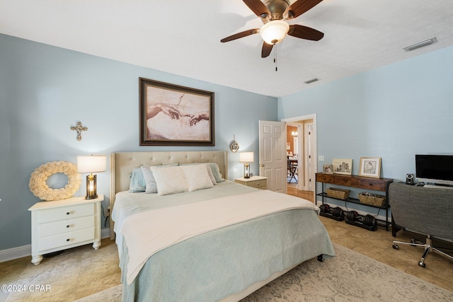 bedroom with ceiling fan, visible vents, baseboards, and light tile patterned flooring