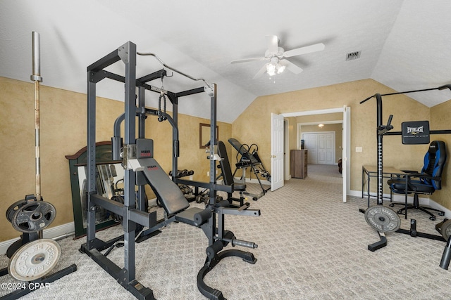 exercise area with ceiling fan, light carpet, visible vents, baseboards, and vaulted ceiling